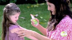 Bloc mosquito repellent being applied outdoors